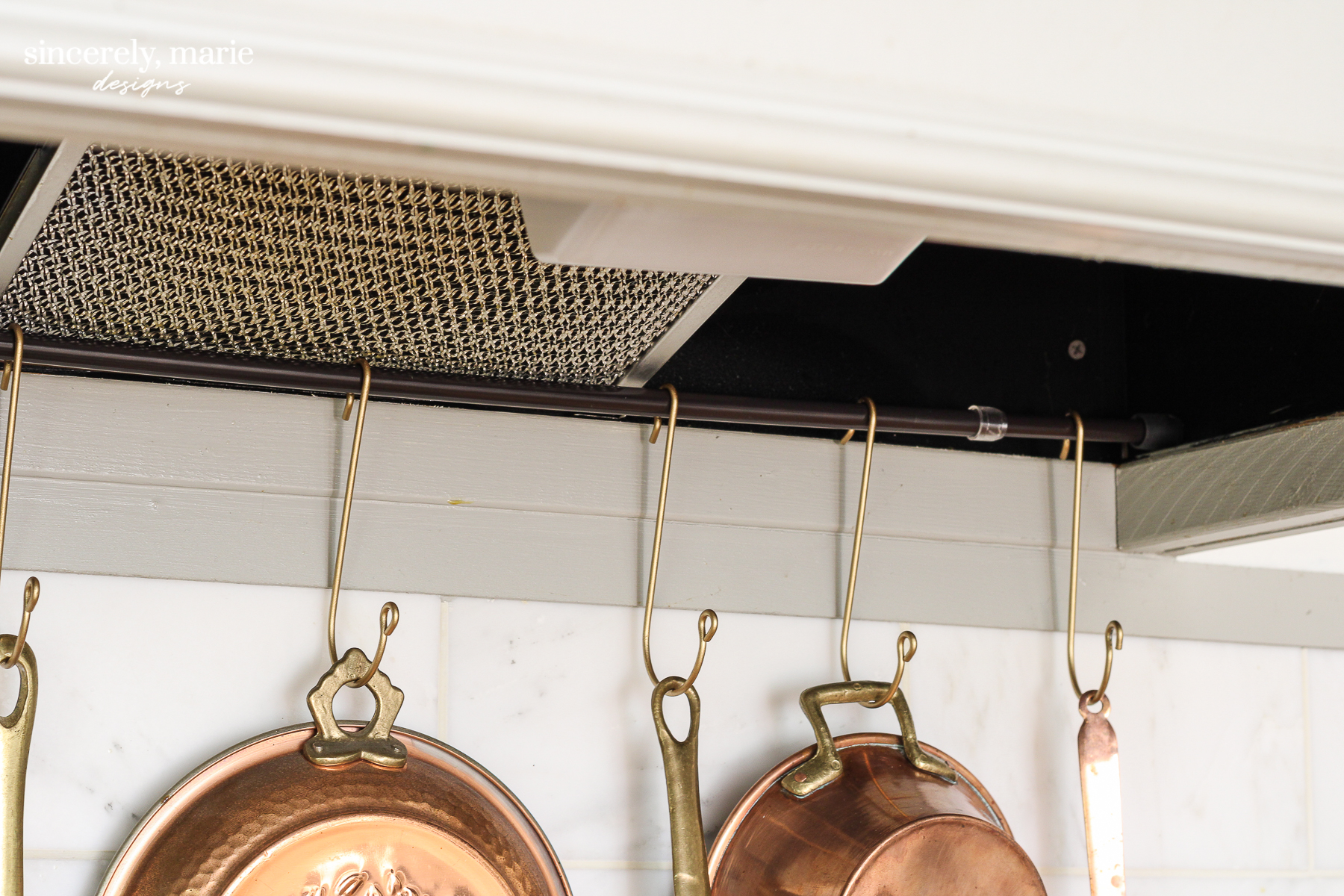 tension rod above kitchen sink