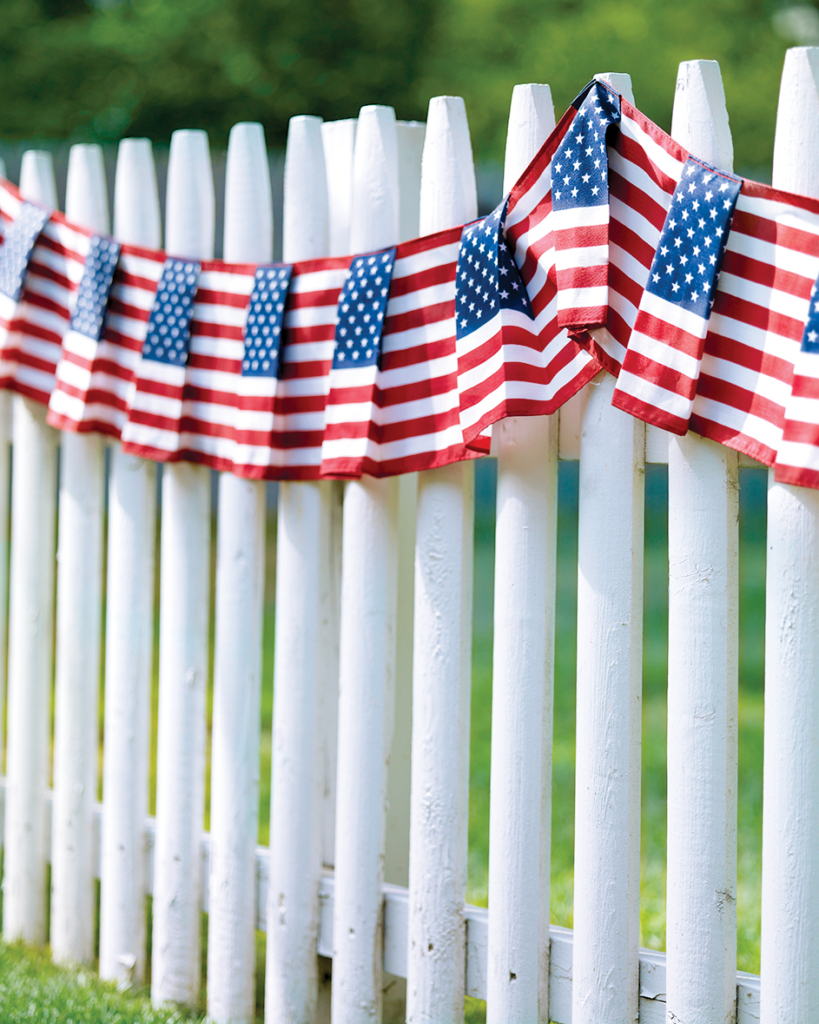Simply hanging an American flag or draping a banner can add the perfect fes...